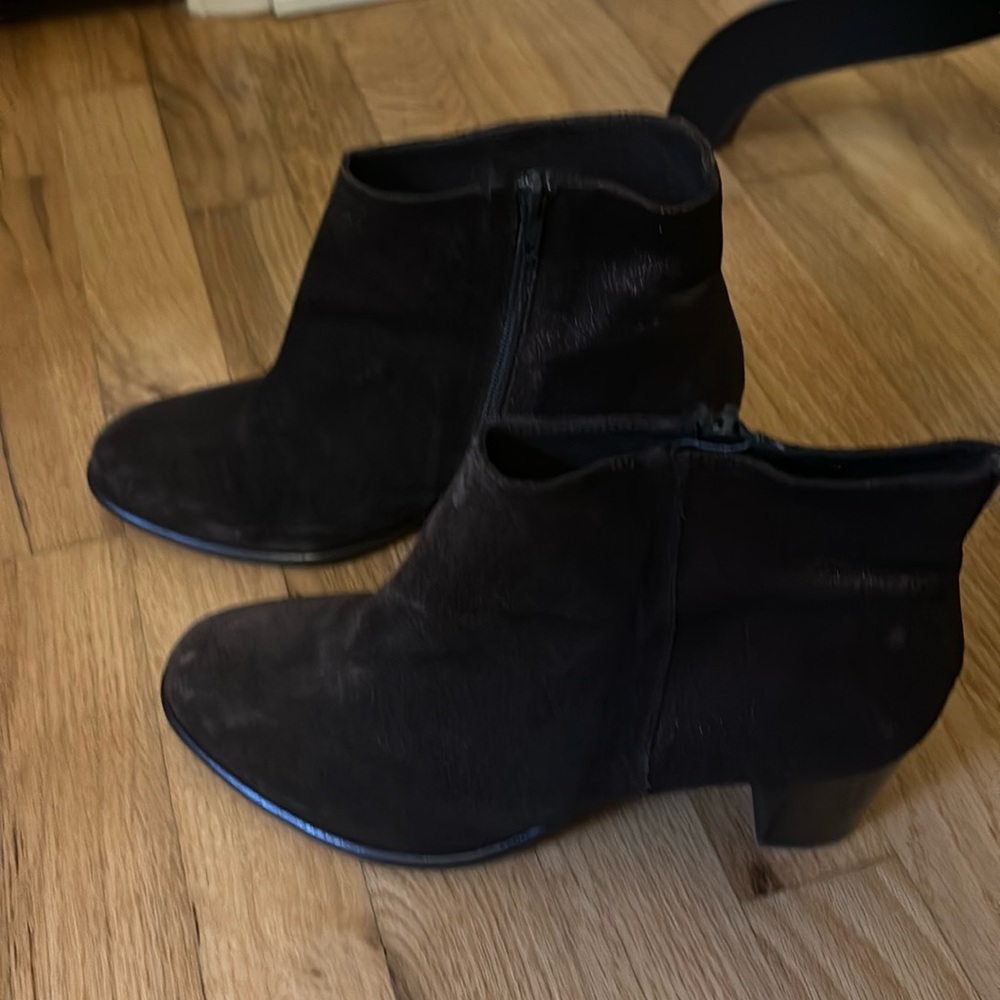 Chocolate brown suede booties with brown iridescent leather on the back heel